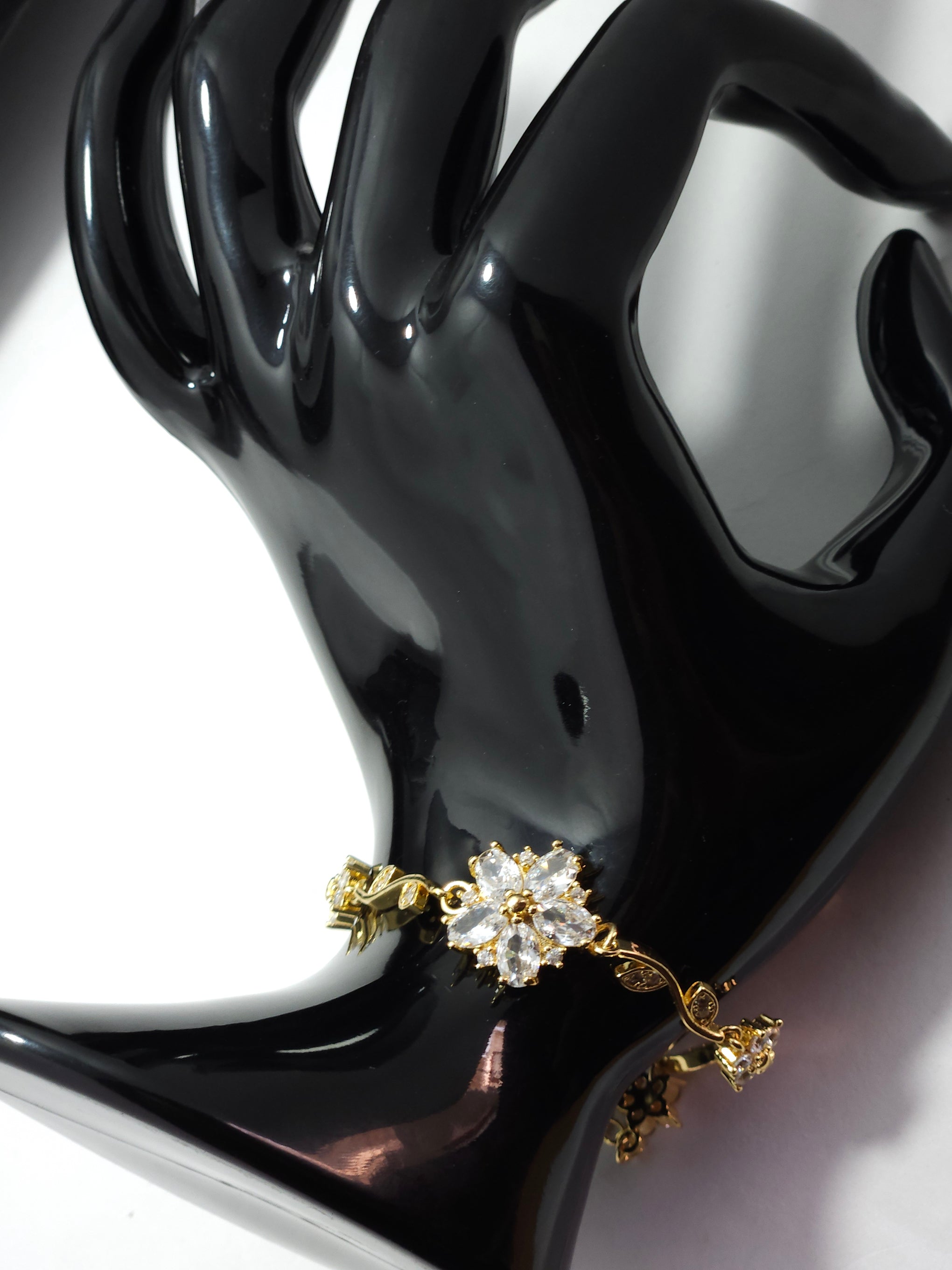 Floral Crystal Charm Bracelet – Gold-Tone Elegant Designer Bracelet