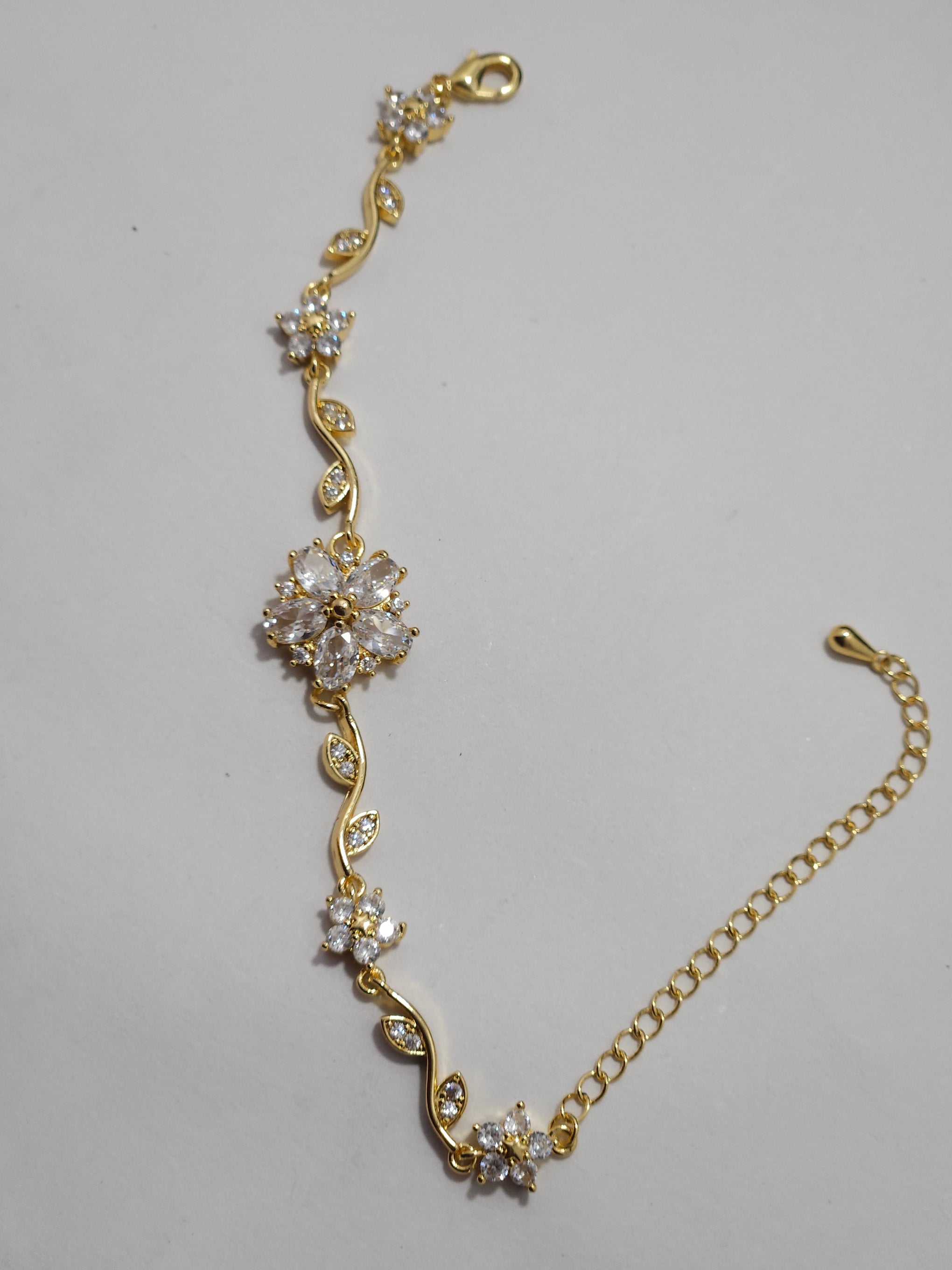Floral Crystal Charm Bracelet – Gold-Tone Elegant Designer Bracelet