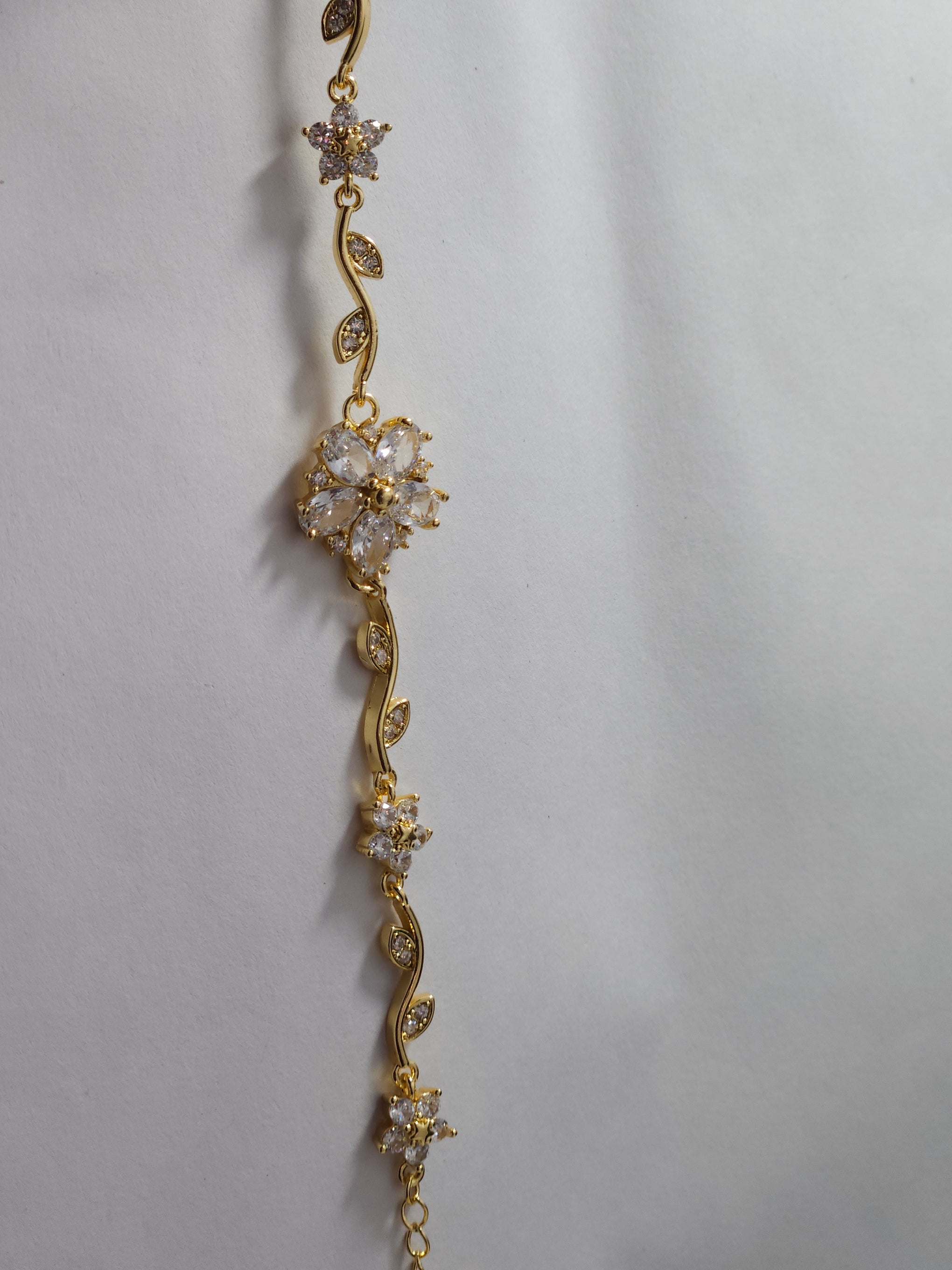 Floral Crystal Charm Bracelet – Gold-Tone Elegant Designer Bracelet