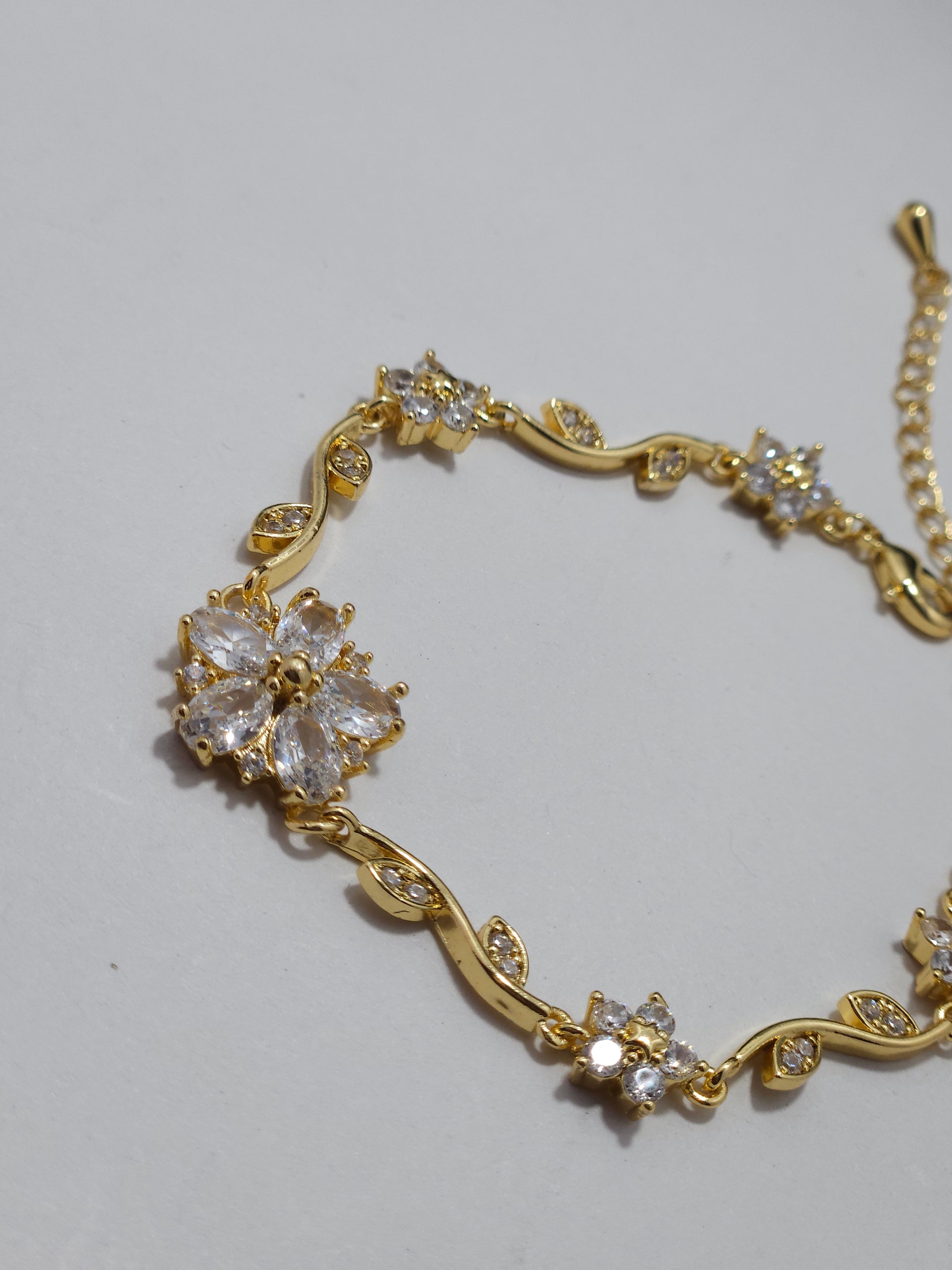 Floral Crystal Charm Bracelet – Gold-Tone Elegant Designer Bracelet