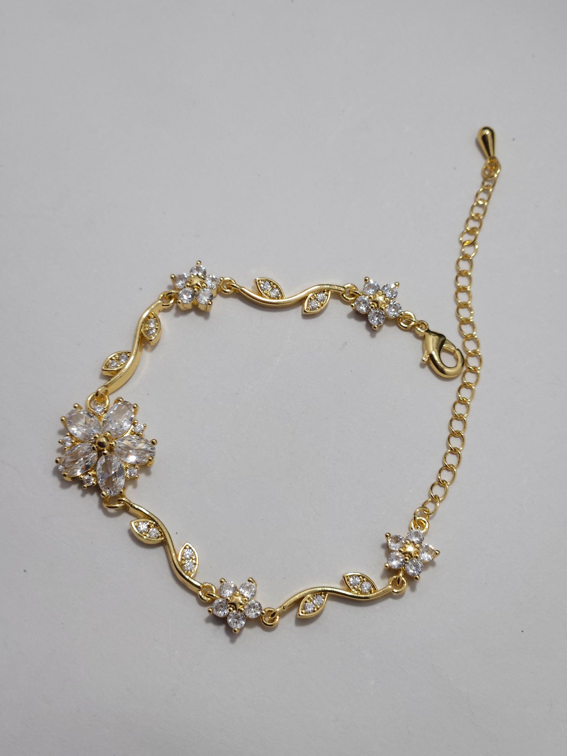 Floral Crystal Charm Bracelet – Gold-Tone Elegant Designer Bracelet